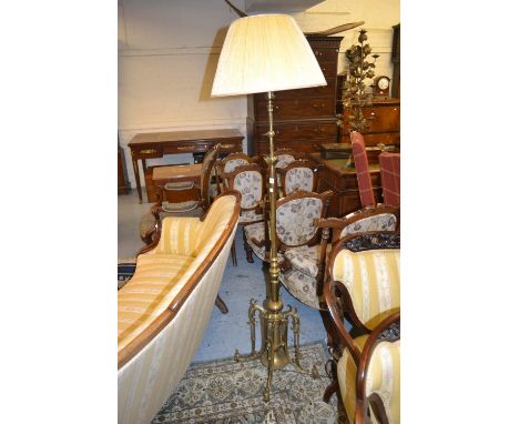 19th Century heavy brass adjustable standard lamp with pleated shade on four cast shaped supportsNothing missing, but they ar