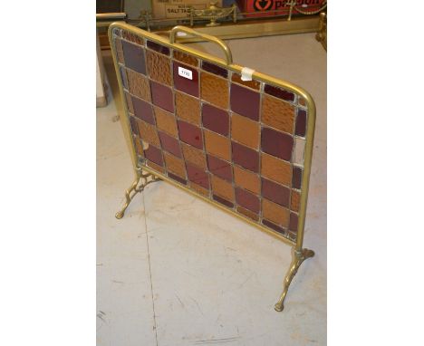 Edwardian brass and leaded glass firescreen together with an adjustable brass fire kerb 