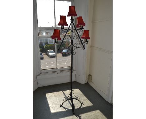 Wrought iron black painted five branch standard lamp with red shades 