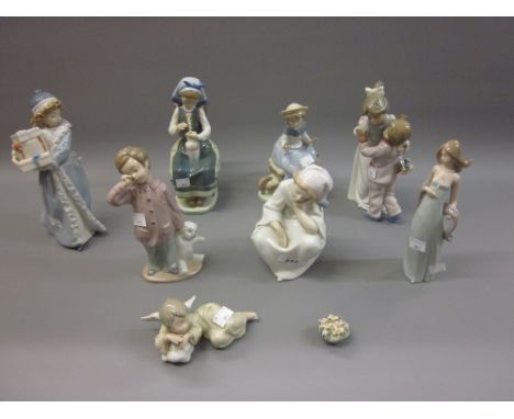 Four various Lladro figures (three at fault) together with four various Nao figures 