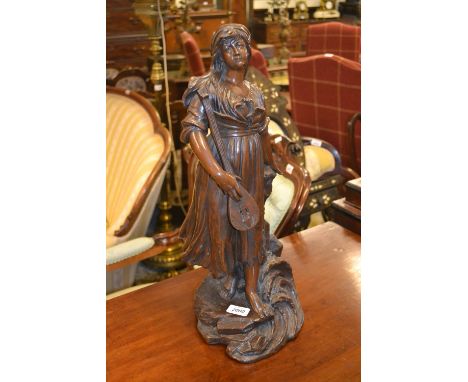 19th Century dark patinated bronzed figure of a woman playing a lute on a naturalistic base, 21ins high 