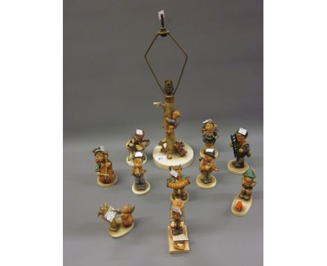 Goebel Hummel table lamp in the form of a boy climbing a tree, together with nine other various Goebel Hummel figures and ano