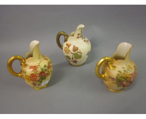 Group of three various Royal Worcester blush ivory flat back jugs with floral decoration 