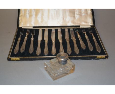 Cased set of six silver handled dessert knives and forks, together with a silver mounted glass inkwell 