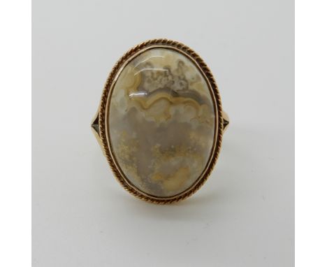 A 9ct gold agate set ring, size N, weight 4.5gms Condition Report: Very light abrasions to the surface of the agate can only 