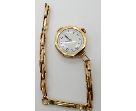 A 9ct gold ladies vintage watch with a 9ct strap with rolled gold clasp, weight including mechanism 17.3gms Condition Report: