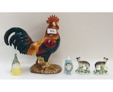 A Beswick leghorn, two Royal Worcester candle snuffers Mr &amp; Mrs Caudle and a pair of  Derbu style dogs Condition Report: 