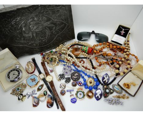 An Arts and Crafts box with a stylised heron, full of vintage costume jewelleryCondition Report: Not available for this lot.