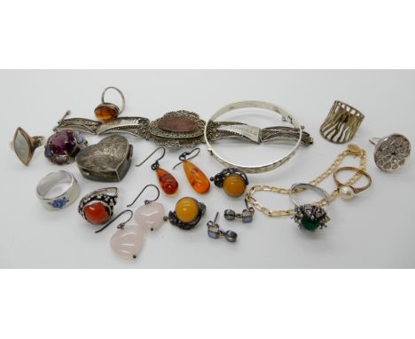 A silver bangle, amber earrings, rings and a heart shaped pill box etcCondition Report: Not available for this lot.