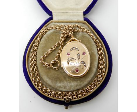 A 9ct gold pearl and red gem set locket with 9ct vintage fancy link chain, length  47cm, weight 10.3gms Condition Report: Ava