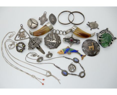 A horn cloak clasp, a large white metal mounted carved green gem face pendant brooch etcCondition Report: Not available for t