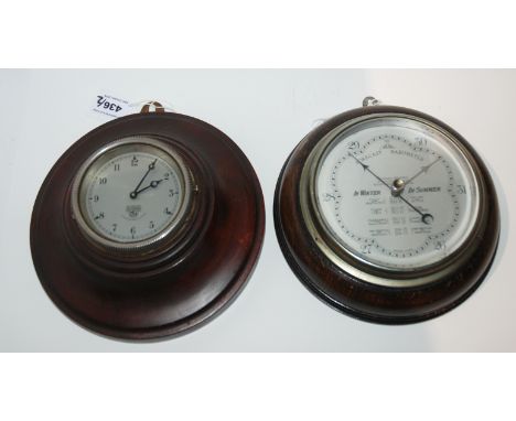 A Smiths circular cased clock and a The Wilson circular barometer, 19cm diameter (2) Condition Report: Available upon request