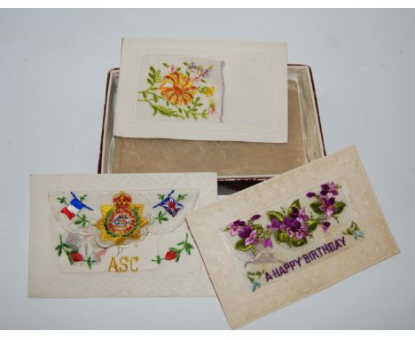 A collection of vintage postcards including embroidered examples and a collection of cigarette card albums Condition Report: 
