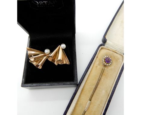 A pair of yellow metal fan shaped pearl set earrings, and a pearl and amethyst pin, weight 3.1gms Condition Report: Available