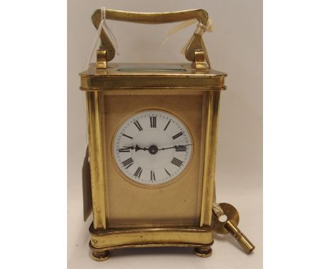 A French brass and glass carriage clock Condition Report: Available upon request