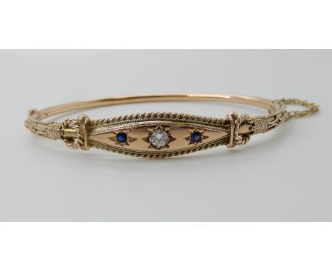 A 9ct gold sapphire and diamond classical revival bangle, with wire work detail, diamond estimated approx 0.15cts, sapphires 