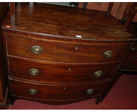 An early 19th century mahogany bowfront chest of three long drawers, on splayed bracket supports, w.94cm