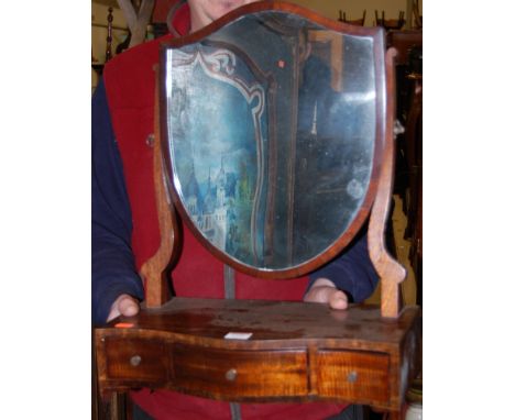 A reproduction mahogany shield shaped swing dressing table mirror, raised on three drawer serpentine boxbase, w.42cm 