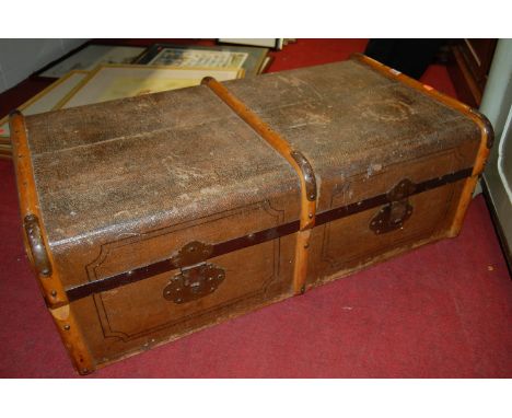 A canvas and bentwood bound trunk, with metal fittings