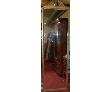 A late 19th century French giltwood pier mirror, having floral decorated broken pediment within egg and dart border, 218 x 64