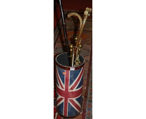 A contemporary Union Jack decorated circular stickstand with sundry contents including; fire tools etc
