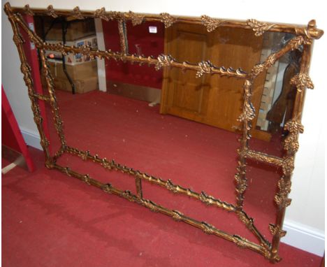 A contemporary floral gilt decorated rectangular wall mirror of good size, 107 x 157cm