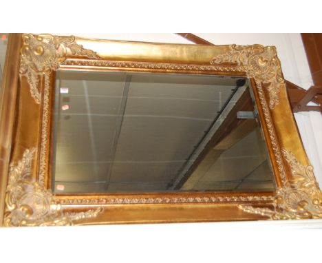 A reproduction gilt framed and bevelled rectangular wall mirror, 120 x 92cm 
