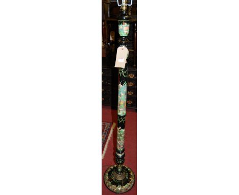 A painted and black lacquered standard lamp, depicting wild animals within a landscape 