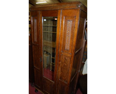 An early 20th century moulded oak single mirror door wardrobe, width 86.5cm