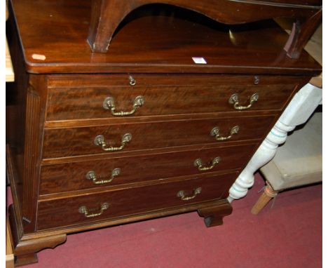 A George III style mahogany chest of four long drawers, having upper brushing slide within fluted canted corners, to ogee bra