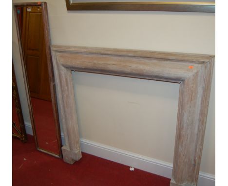 A limed pine fire surround; together with a further limed wood rectangular wall mirror (2) 