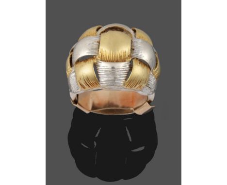 An 18 Carat Two Colour Gold Ring, of a yellow and white textured weave design, to white shoulders of a similar pattern, to a 
