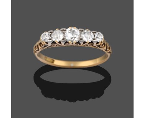 A Diamond Five Stone Ring, the graduated old cut diamonds in a scroll setting on a plain polished shank, total estimated diam