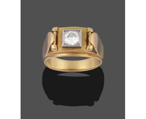 A Diamond Solitaire Ring, the round brilliant cut diamond in a white collet setting, to a further fancy yellow border, on a y