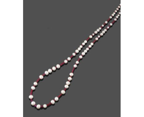 A Ruby and Cultured Pearl Necklace, faceted ruby roundel beads spaced by groups of cultured pearls, length 64cm see illustrat