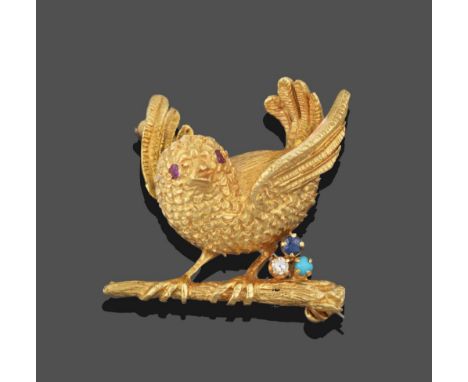 An 18 Carat Gold Sapphire, Diamond, Turquoise and Ruby Chick Brooch, the chick modelled with its wings raised on a branch wit