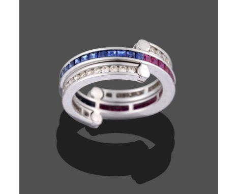 A Ruby, Sapphire and Diamond Eternity 'Flip' Ring, the main band channel set in white with step cut rubies on one half and sa