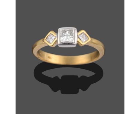 An 18 Carat Gold Diamond Three Stone Ring, the princess cut diamonds set with the two outer diamonds at an angle to the centr