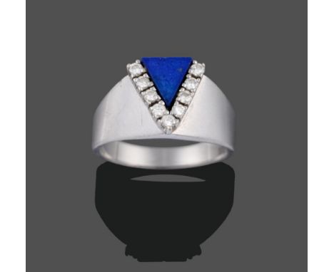 A Contemporary Lapis Lazuli and Diamond Ring, a triangular panel of lapis lazuli with round brilliant cut diamonds in white c