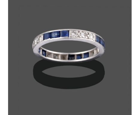 A Sapphire and Diamond Eternity Ring, trios of square step cut sapphires alternate with trios of eight-cut diamonds in a whit