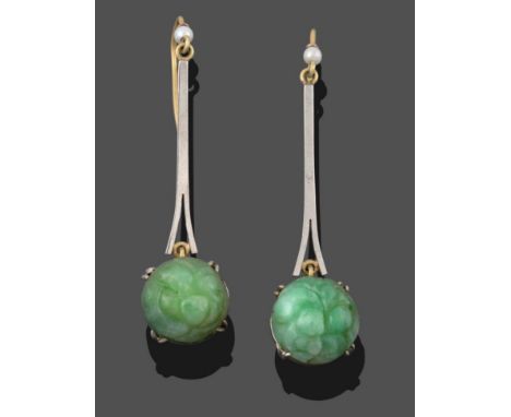 A Pair of Jade and Cultured Pearl Drop Earrings, an ornately carved jade cabochon in a white claw setting suspended from a wh