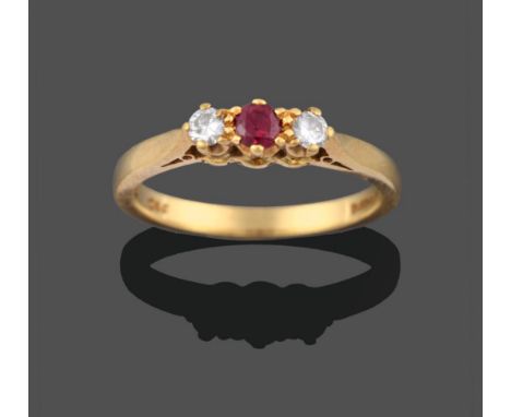 An 18 Carat Gold Ruby and Diamond Three Stone Ring, by Cropp &amp; Farr, the central round brilliant cut ruby flanked by two 