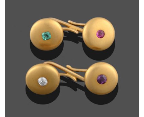 A Pair of Gem Set Cufflinks, circular yellow metal panels attached by S-shaped links each set centrally with a gemstone, one 