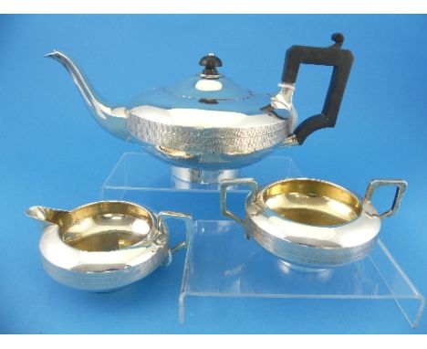 A George V silver three piece Tea Set, by Charles S. Green &amp; Co. Ltd., hallmarked Birmingham, 1926, of squat circular for
