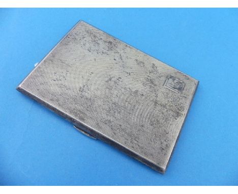 A George V silver Cigarette Case, hallmarked Birmingham, 1935, of hinged rectangular form, the whole engine turned, the carto