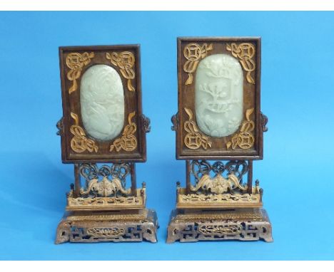 A pair of Chinese old white jade and hardwood Table Screens, each with applied softwood decoration and inset with oval jade p