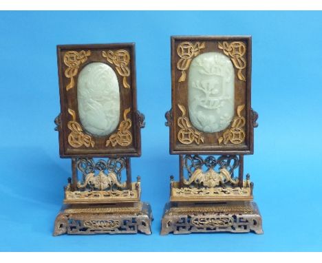 A pair of Chinese old white jade and hardwood Table Screens, each with applied softwood decoration and inset with oval jade p