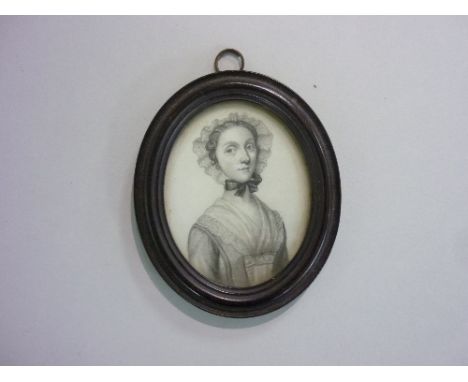 18th century English School, an oval portrait miniature of a young woman, pencil, in oval ebonised frame, 3¼in x 2¾in (8.25cm