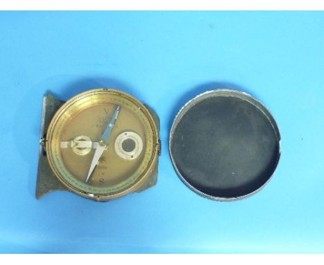 A vintage German C. P. Goertz Berlin brass-cased Artillery Compass, no.9898 and "1.18", with cover, 4?in (10.5cm) diameter, t