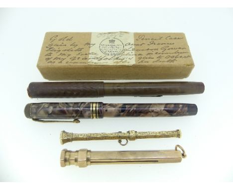 A Victorian gold Propelling Pencil, engine turned decoration and with inscription dated 1853, the finial with woven hair, unm